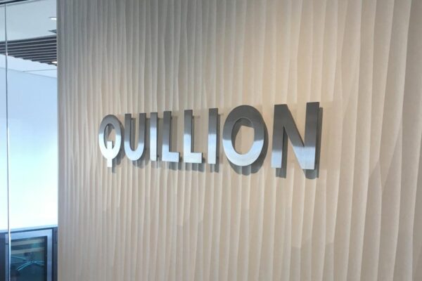 a freestanding pylon sign inside an office lobby
