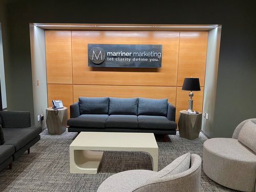 an indoor lobby sign for Mariner Marketing