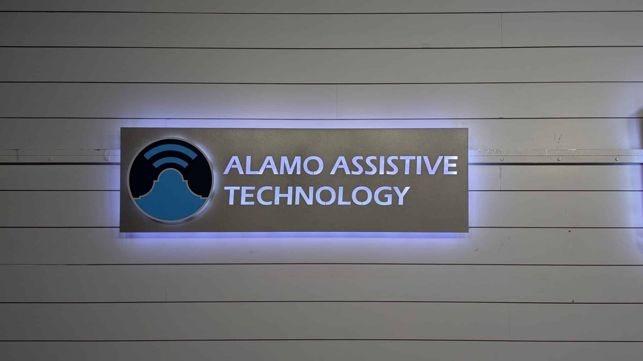 Outdoor backlit cabinet sign for Alamo Assistive Technology with blue LED halo lighting
