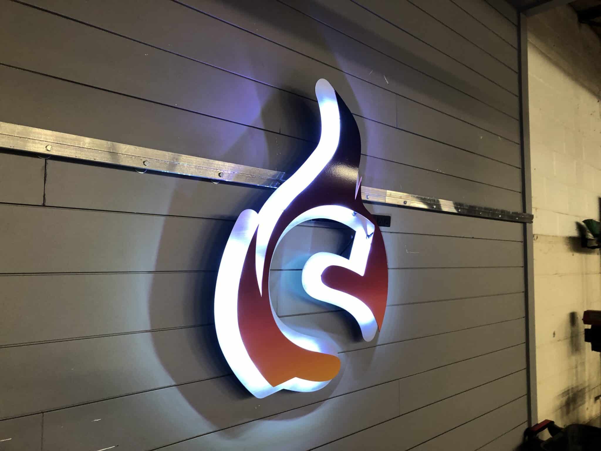 Halo-lit custom metal logo sign for Spark Membership creating dimensional depth on the wall