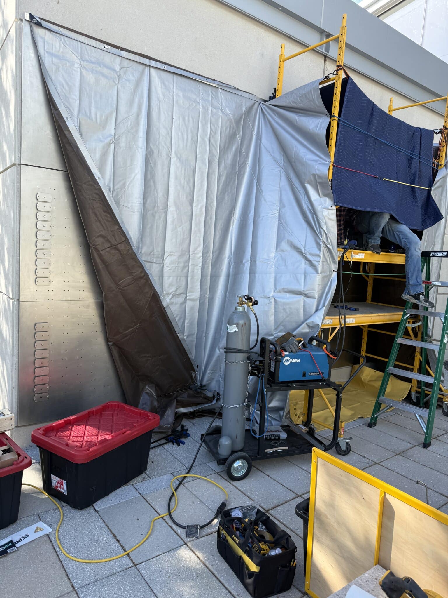 On-site welding setup with tarps