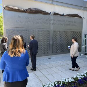 People admiring the completed Veterans Memorial Wall