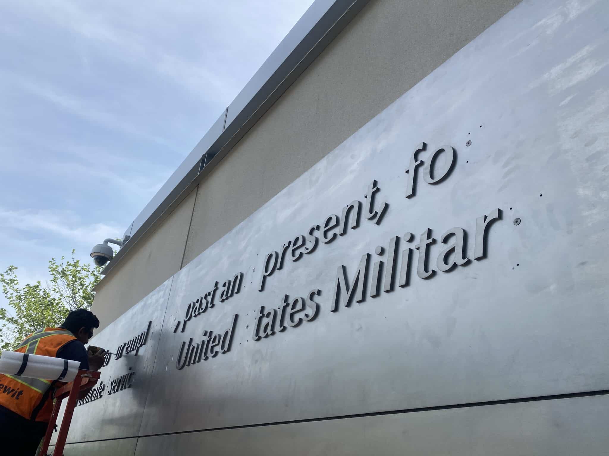 Close-up of raised stainless steel lettering