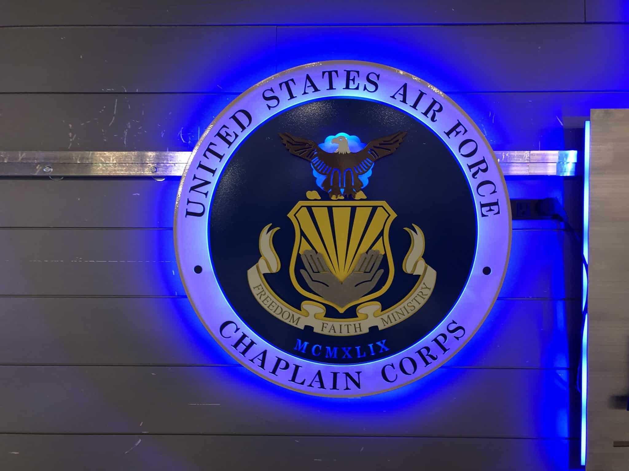 United States Air Force Chaplain Corps seal in blue and gold, halo-lit LED and glowing blue.