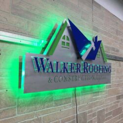Walker Roofing & Construction sign with a cut roofline above the name, halo-lit LED and glowing green.