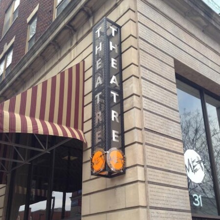 outdoor blade sign for a movie theater