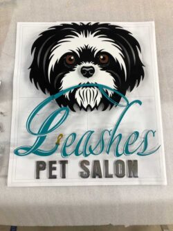 Leashes Pet Salon layout proof with a shih tzu portrait above teal script lettering, before fabrication.