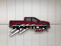 Raptor SVT wall piece shaped as a red pickup truck with claw marks torn through the name.