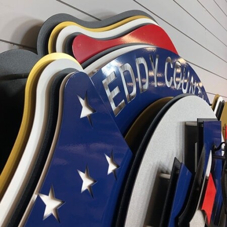Eddy County Fire & Rescue badge seen edge-on, showing how many layers the build stacks up.
