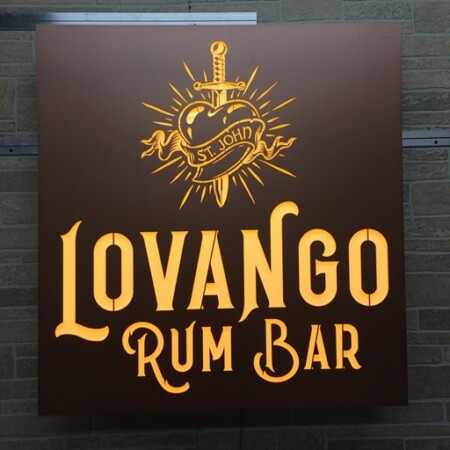 Lovango Rum Bar face-lit led panel sign in brown with a gold sacred heart and sword above the name.