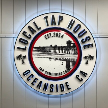 Local Tap House sign with the halo switched to blue, the pier photograph still the center of the ring.