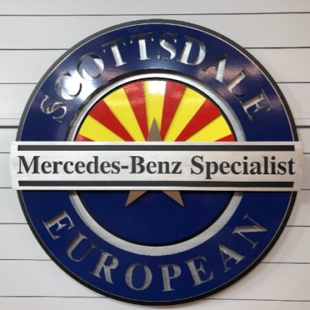 Scottsdale European Mercedes-Benz Specialist round sign in navy with the Arizona sunburst behind the name bar.