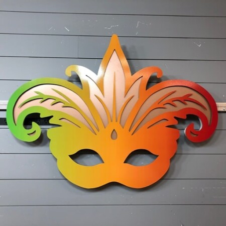 Boudreaux Cajun Steakhouse halo-lit LED Mardi Gras mask sign in a green-to-red gradient.