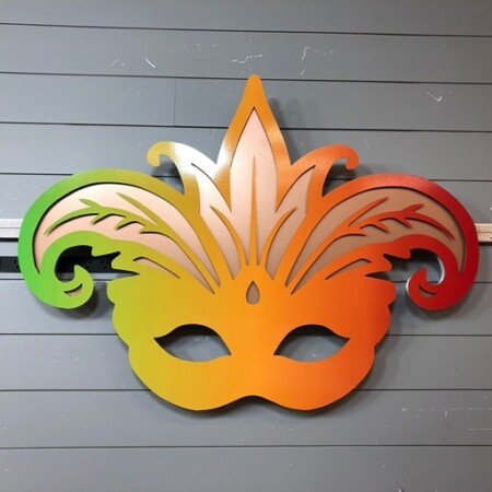 Boudreaux Cajun Steakhouse halo-lit LED Mardi Gras mask sign in a green-to-red gradient.