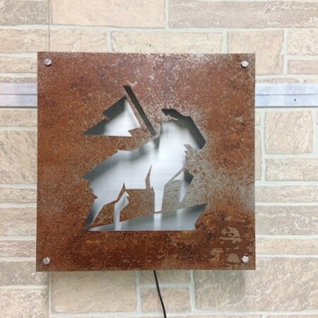 Crook and Marker cut-out plate sign, the figure knocked clean out of the rusted steel.