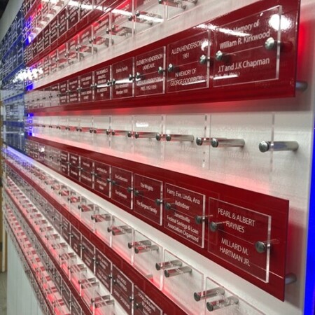 Close view of the Jarrettsville donor flag, each stripe a row of engraved acrylic dedication plates.